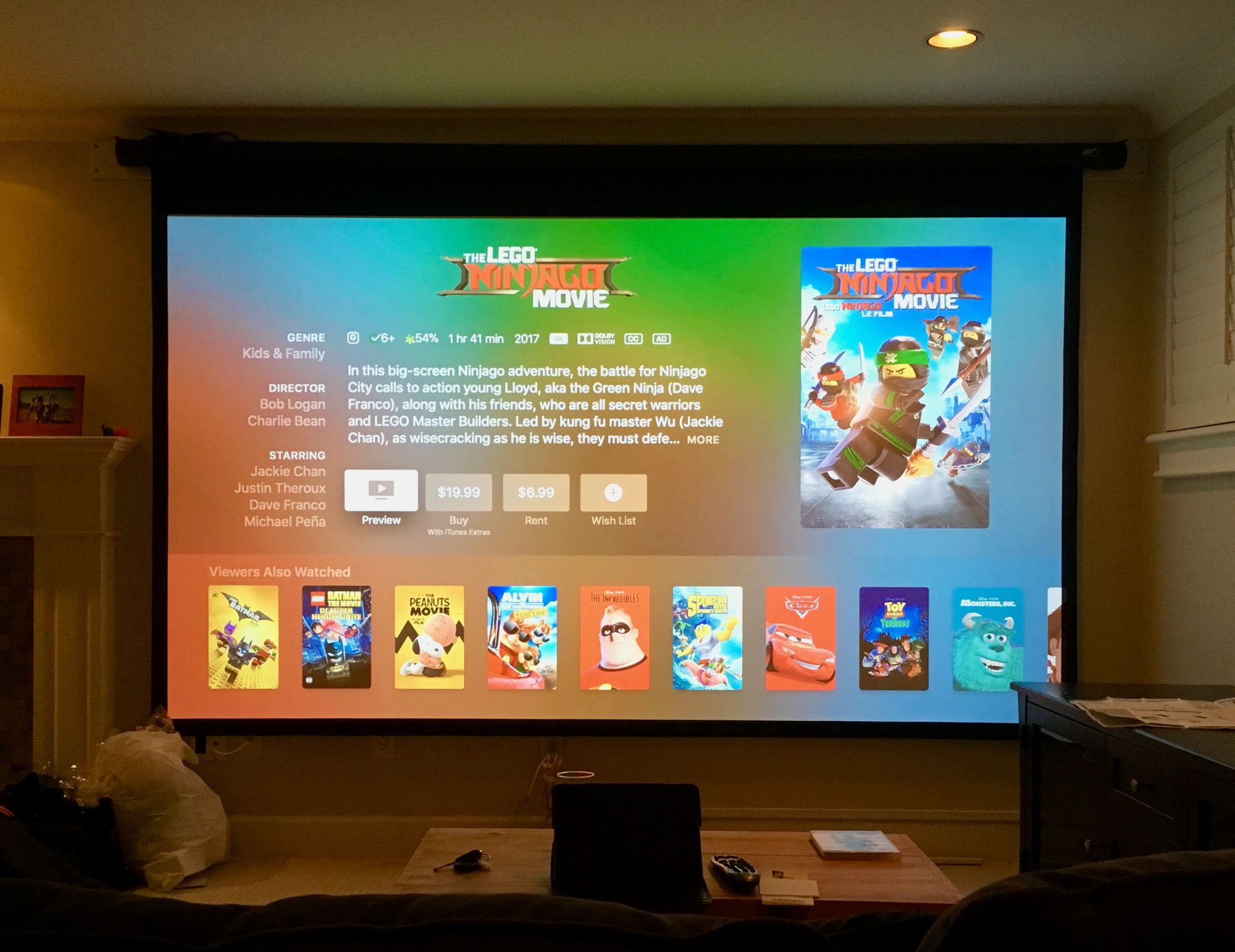 A large projection screen in a client's home theatre.